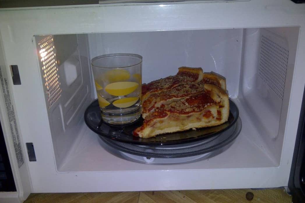 Reheat pizza in the microwave oven