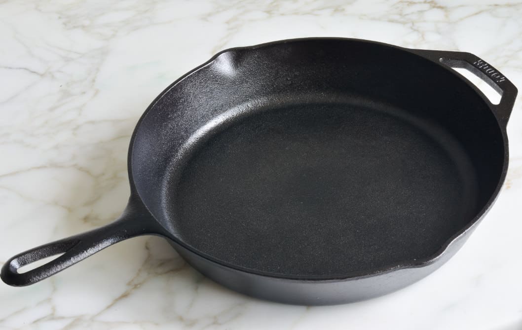 why does my cast iron skillet has black residue