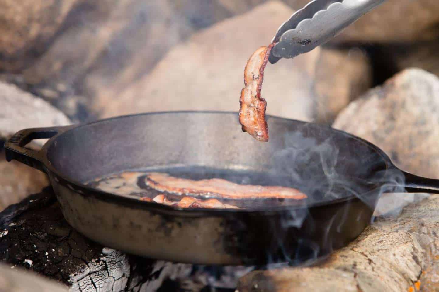 Why cast-iron pans smoke