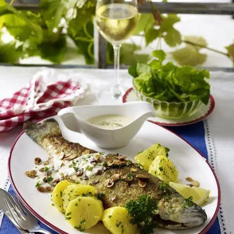 Herb-Infused Poached Trout with Lemon Butter Sauce
