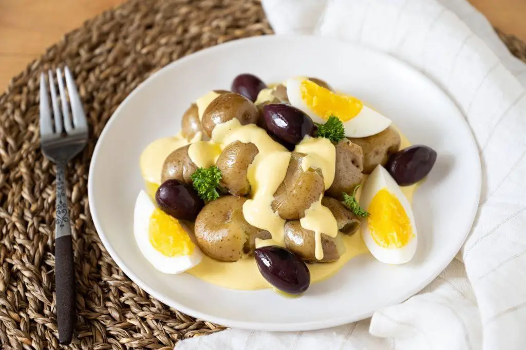Papa a la Huancaina with Olives and Parsley